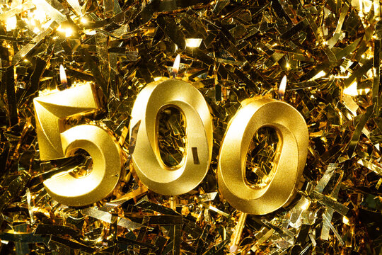 500 followers or subscribers, card golden birthday candle gold tinsel background. blogs celebration. Five hundred fans.