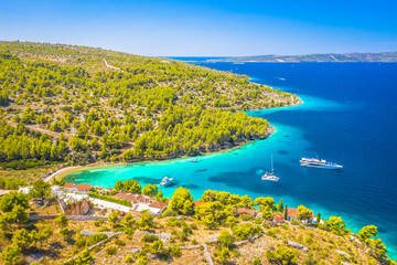 Aerial view of a secluded cove in Bobovisca na Moru on Brac Island, Croatia, showing turquoise Adriatic waters, rocky shores, and lush summer vegetation in a peaceful Mediterranean setting © dreamer4787