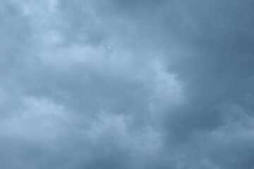 dark rain cloud floating on sky at sunset in evening