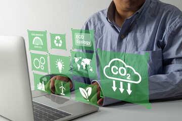 Green technology and eco-friendly concept with digital interface showing icons of zero emissions, CO2 reduction, recycling, renewable energy, and sustainable ecology for environmental awareness.