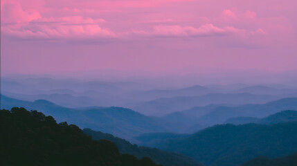Obraz premium The sky is a beautiful pink color with clouds in the background