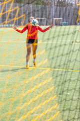 Obraz premium Girl on the soccer field. Soccer training. Active lifestyle. Football concept.