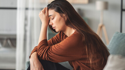 Sad young woman dealing with loss and psychological trauma