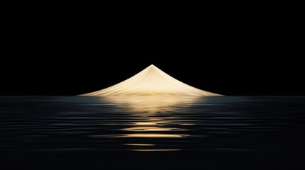 A single light source illuminates a dark body of water, casting a long, narrow reflection.