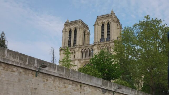 Riverboat cruise on the Seine. View on the Notre-Dame de Paris or Notre-Dame, medieval Catholic cathedral on the island de Cite (an island in the River Seine) in French Gothic style.