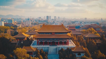 Aerial view of the Forbidden City in Beijing, China, with cityscape in background, golden colored roofs.