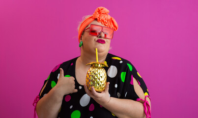 Stylish Woman with Pineapple Drink Against Pink Background