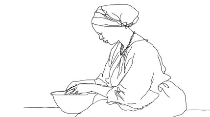 Fototapeta premium A woman is sitting at a table with a bowl in front of her