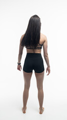 Young beautiful woman with athletic body on white background. Fitness girl
