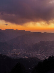 City in The Mountains at Sunset