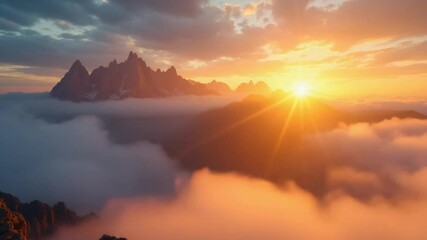 timelapse of a breathtaking sunrise over a mountain horizon, with the first light of day breaking through the clouds. The shot begins in close-up, focusing on the dramatic interplay of light and