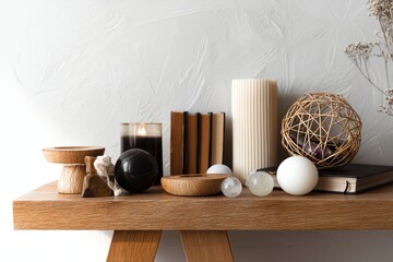 Stylish home decor with candles and natural elements.