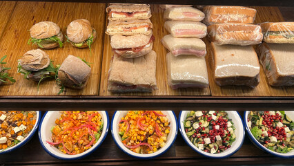 Variety of Sandwiches and Salads Displayed Delicious assortment ready for purchase in a cafe Bakery