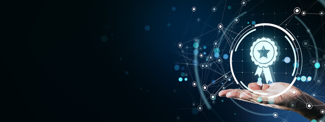 Person holding digital award icon with technology connections on blue abstract background,...