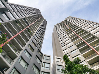 Modern High-Rise Apartment Buildings, Low Angle Urban Architecture. POV: perspective view of...