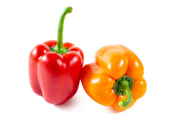 Fresh juicy shiny red and orange bell peppers.