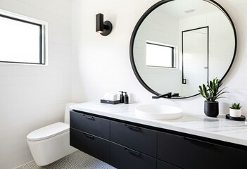A bathroom with two sinks and a round mirror.