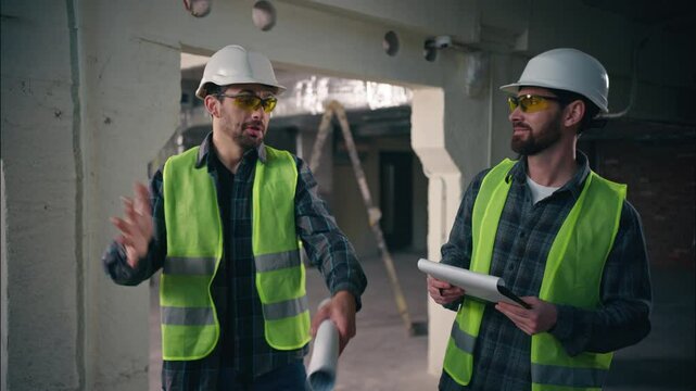 Frustrated Caucasian men inspectors workmen complain in construction angry guys builders talking foremen contractors gesturing sleep miss deadline industrial production architects working conversation