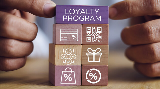 Wooden blocks stacked, showcasing loyalty program concept with icons: credit card, QR code, gift, shopping bag, percentage symbols, symbolizing rewards and customer retention
