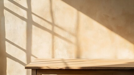 Wooden table in warm beige tones, stucco wall background with soft window shadows, natural earthy aesthetic, clean and minimal composition.  