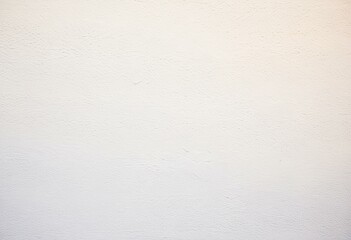 Obraz premium A white wall with a small hole in it.