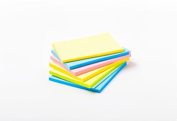A stack of sticky notes on a white surface.