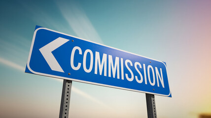 Blue road sign with white arrow and word "Commission", set against a blurred sky background, signifying direction, guidance, and business opportunity