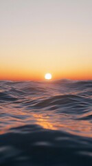 Beautiful sunset in the sea. The sun is reflected in the water. Vertical wallpaper.