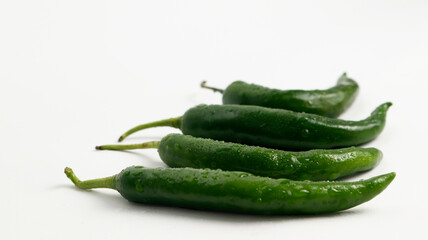 fresh green chili pepper. a group of green chili and very fresh ingredients. sliced chili