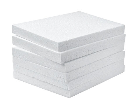 Stack of white foam boards arranged neatly in a pile.