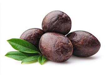 Obraz premium Dark brown, glossy seeds in a pyramid shape, with fresh leaves