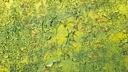 Weathered yellow painted wall close-up texture