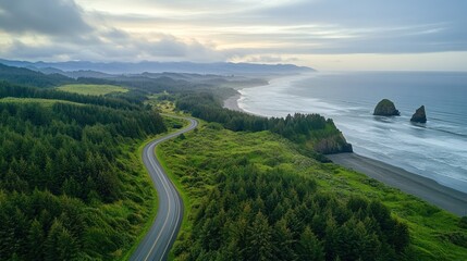 Scenic coastal highway winding through lush greenery, overlooking a pristine beach and rugged coastline