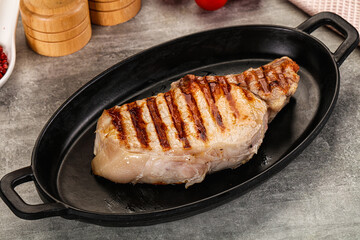 Grilled pork loin steak with bone