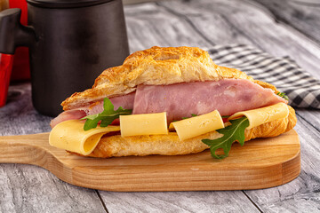 Fresh croissant with ham and cheese