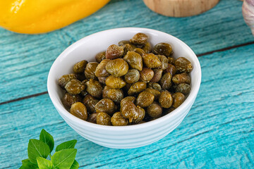 Pickled canned capers in the bowl