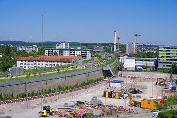 Fototapeta premium High angle view of opening day of park named Überlandpark on top of highway enclosure on a sunny spring Saturday. Photo taken May 10th, 2025, Zurich Schwamendingen, Switzerland.