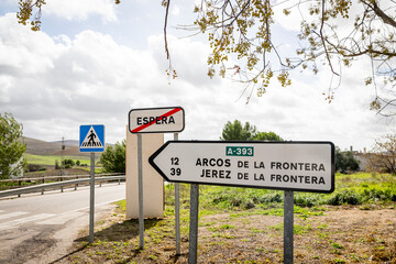 traffic signpost leaving Espera pointing the way and distance to Arcos de la Frontera and Jerez de la Frontera, province of Cádiz, Andalusia, Spain