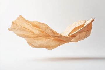 Beige paper draped in mid-air