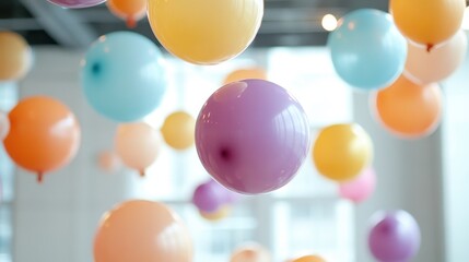 A vibrant collection of colorful balloons suspended in the air, creating a joyful and playful ambiance, perfect for festive events or celebrations and capturing the essence of happiness.
