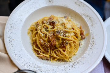 Fresh pasta   spaghetti  carbonara and Aperol Spritz  at  typical italian resaturant at Trastevere   neighbourhood at Rome 