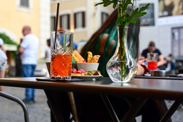  Aperol Spritz  and tipical italian snack for aperitivo in a bar in Rome, Italy