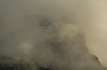 A peak among dark clouds