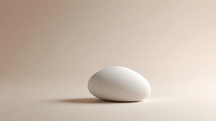 Single egg on a beige background