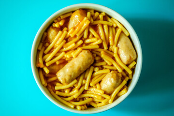 A Bowl of Classic Spaghetti in Tomato Sauce With Pork Sausages