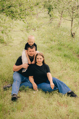 Family Portrait in Outdoor Setting with Smiling Faces