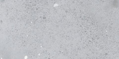 Fototapeta premium Close up view of a light gray terrazzo surface with small fragments and a smooth polished texture look 