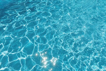 Obraz premium Clear blue water with sunlight reflecting on the rippling surface.