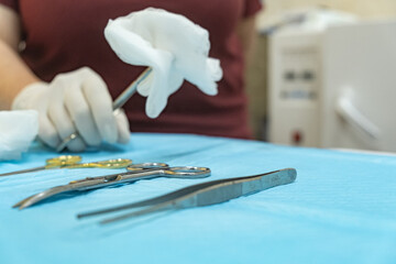 Nurse preparing surgical instruments in a veterinary clinic before an operation. Concept veterinary...