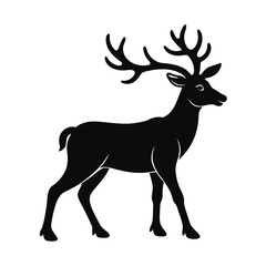 Fototapeta premium Silhouette of a majestic deer walking quietly in a natural habitat during the early morning light